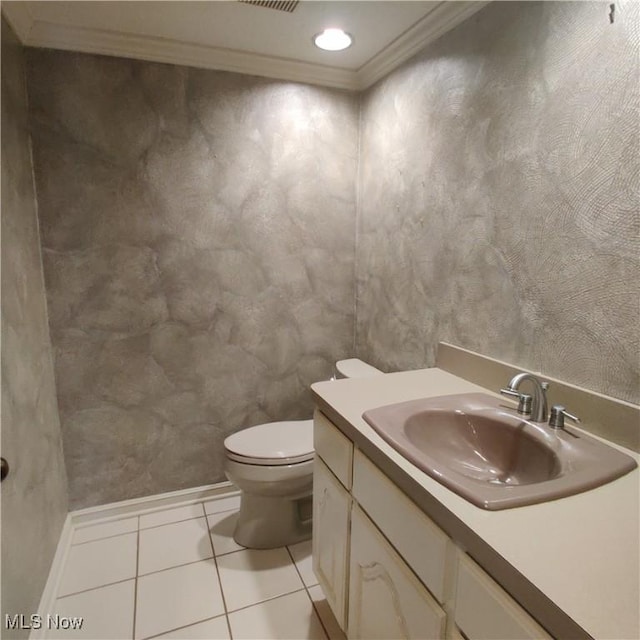 bathroom featuring ornamental molding, toilet, tile patterned flooring, and vanity