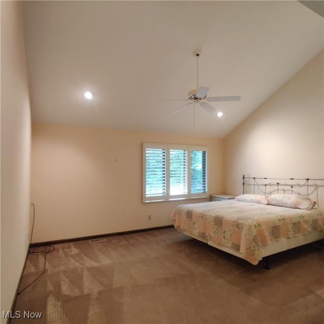 carpeted bedroom featuring lofted ceiling and ceiling fan