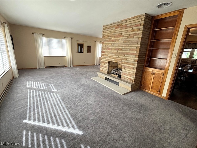 unfurnished living room featuring a fireplace and carpet