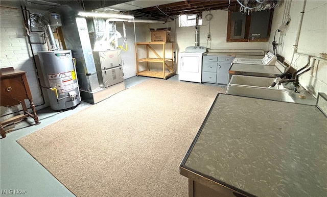 basement featuring water heater, heating unit, sink, and washer / clothes dryer