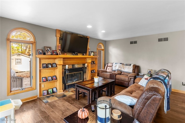 370 Wilcox Rd, Austintown, OH 44515 - living room with dark wood-style flooring, recessed lighting, baseboards, and a fireplace with flush hearth