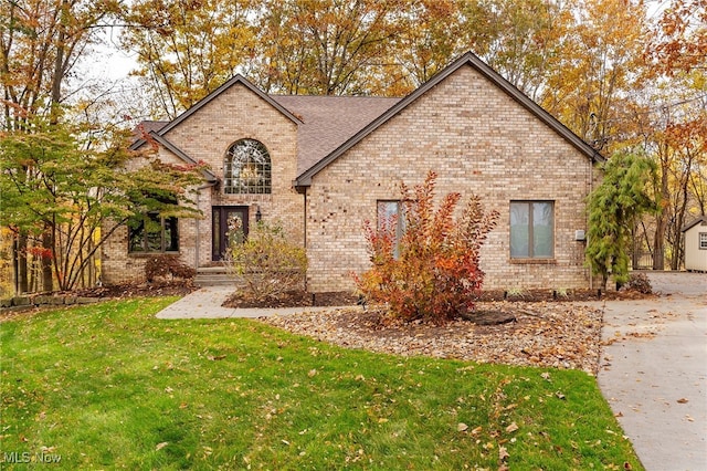 370 Wilcox Rd, Austintown, OH 44515 - view of front of home featuring brick siding and a front yard