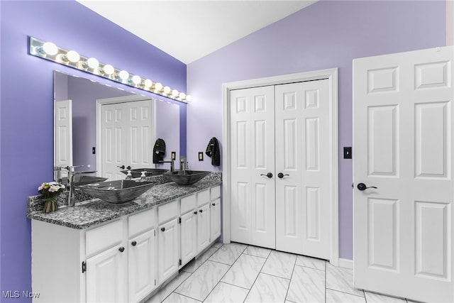 370 Wilcox Rd, Austintown, OH 44515 - bathroom featuring vaulted ceiling and double vanity