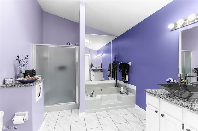 370 Wilcox Rd, Austintown, OH 44515 - full bathroom featuring vaulted ceiling, vanity, a shower stall, a bath, and marble look tile flooring