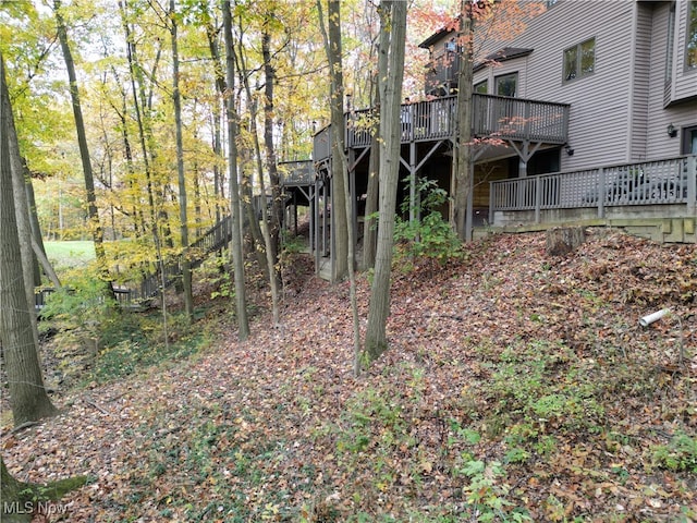 view of yard with a wooden deck