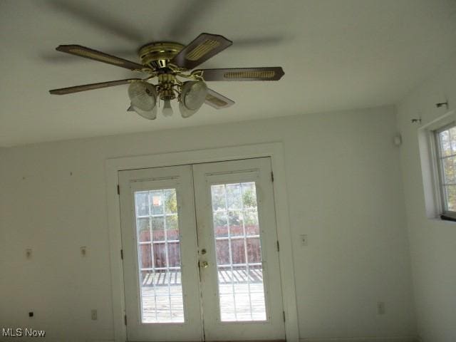 doorway to outside featuring french doors, plenty of natural light, and ceiling fan