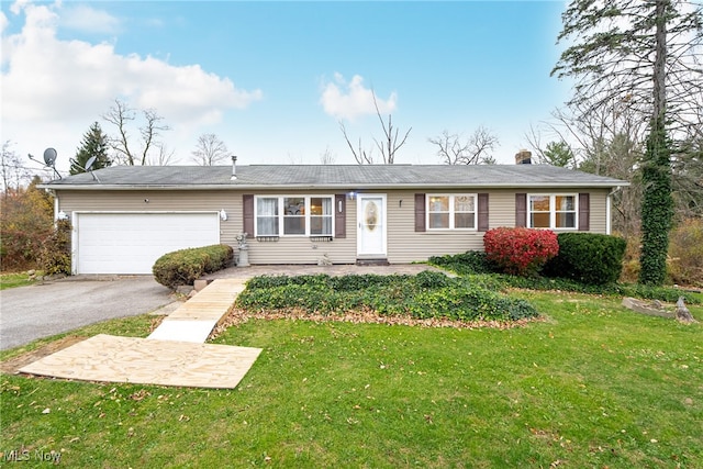 single story home with a garage and a front yard