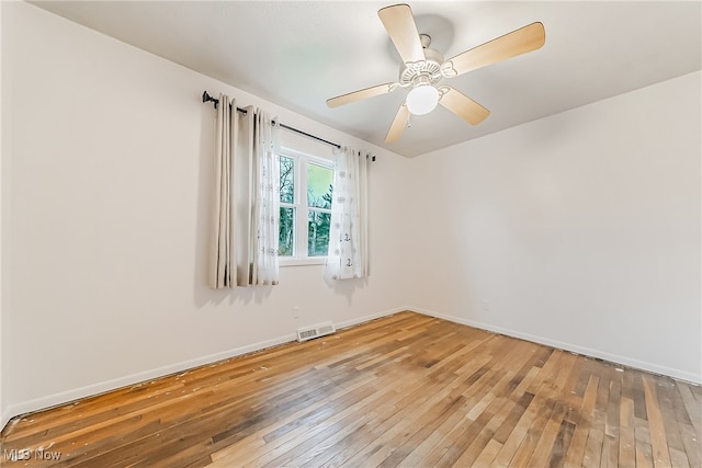 unfurnished room featuring ceiling fan and wood-type flooring