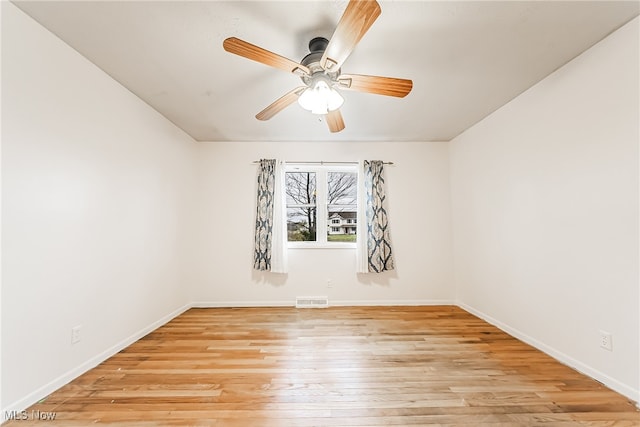 empty room featuring light hardwood / wood-style floors and ceiling fan