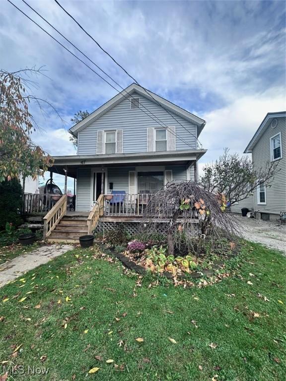 47 Swan St, Geneva, OH 44041 - view of front of house featuring a porch and a front lawn