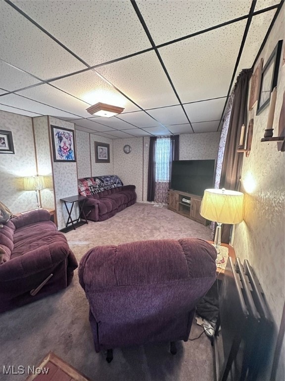 carpeted bedroom with a paneled ceiling