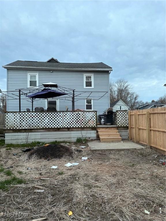 47 Swan St, Geneva, OH 44041 - back of house featuring fence and a deck
