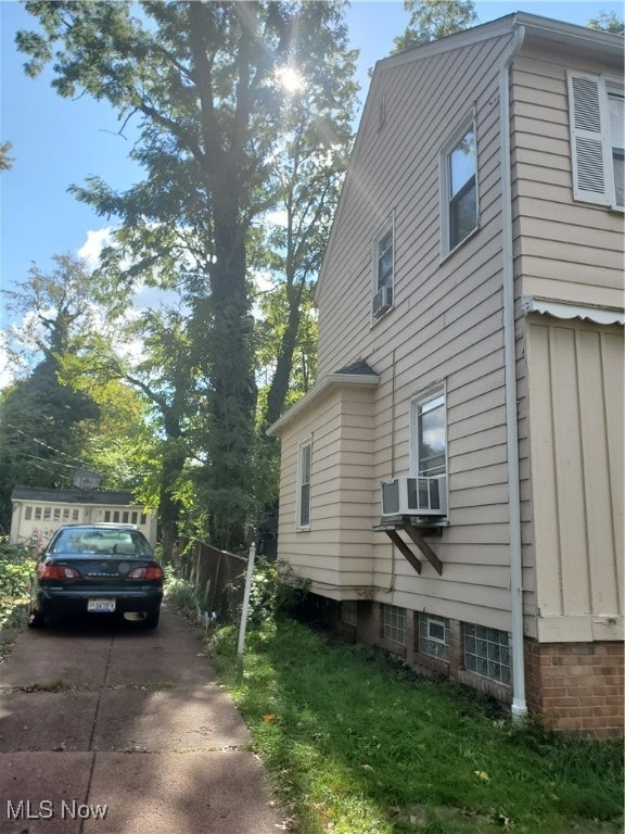 view of side of home with cooling unit