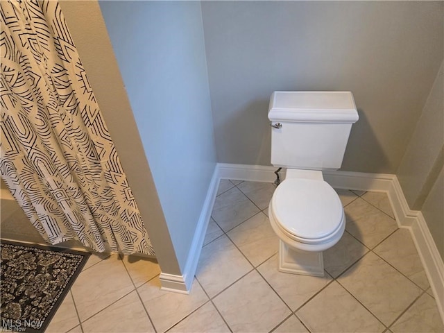 bathroom with tile patterned flooring and toilet