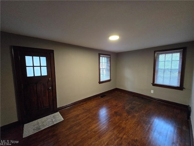 entrance foyer with dark hardwood / wood-style floors