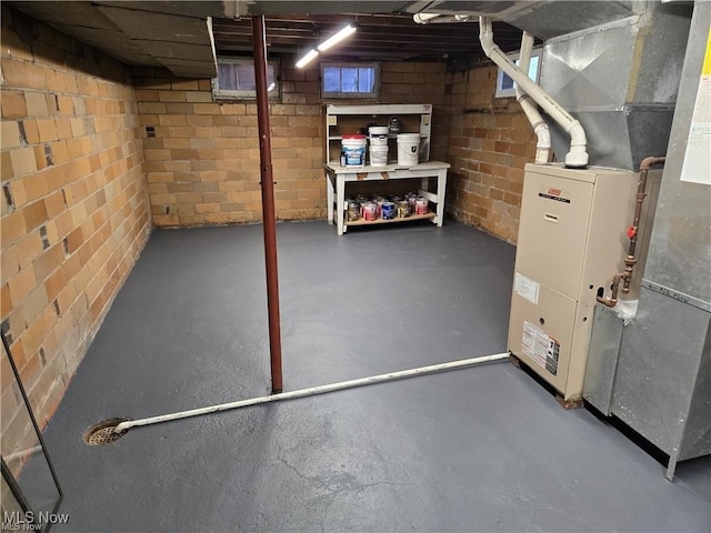 basement featuring heating unit