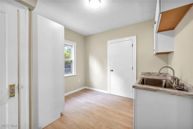 kitchen featuring sink and light hardwood / wood-style floors