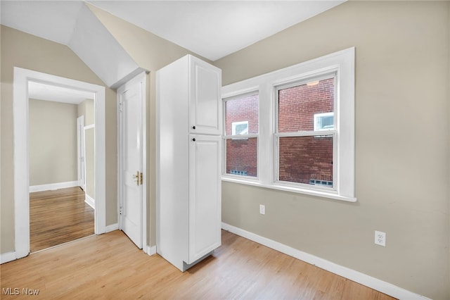 unfurnished bedroom featuring light wood-type flooring