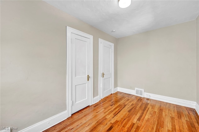 unfurnished bedroom featuring light wood-type flooring