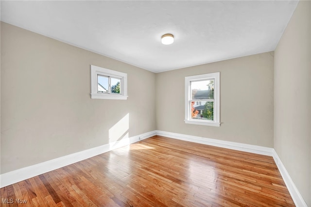 spare room with light wood-type flooring