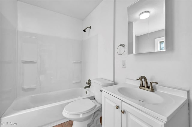 full bathroom featuring washtub / shower combination, toilet, and vanity