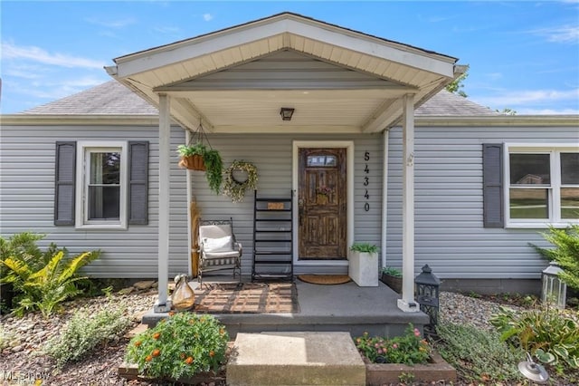 property entrance featuring a porch