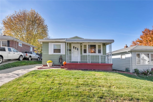 bungalow-style house featuring a porch and a front yard