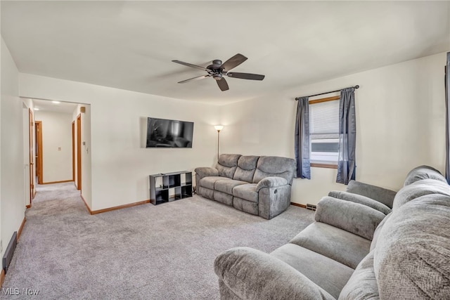 carpeted living room with ceiling fan