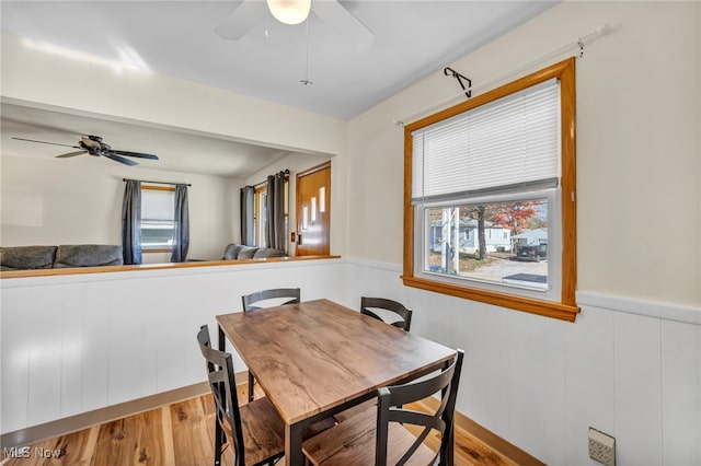 dining area with light wood-type flooring and plenty of natural light