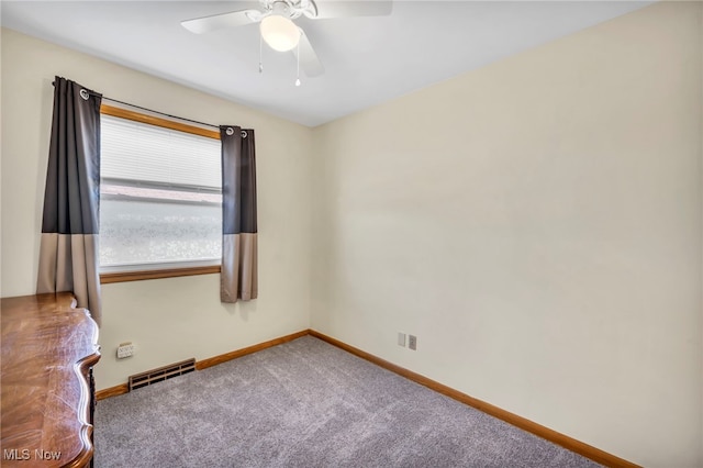 carpeted empty room with ceiling fan