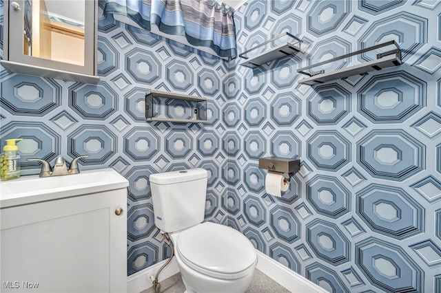 bathroom featuring vanity and toilet