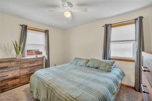 carpeted bedroom featuring ceiling fan