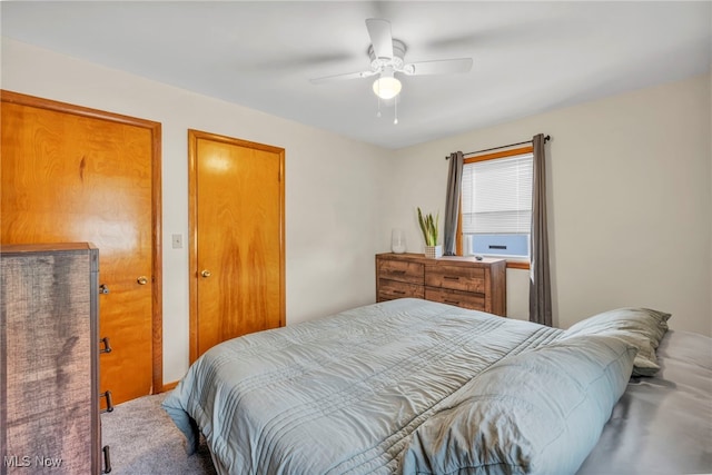 carpeted bedroom with ceiling fan