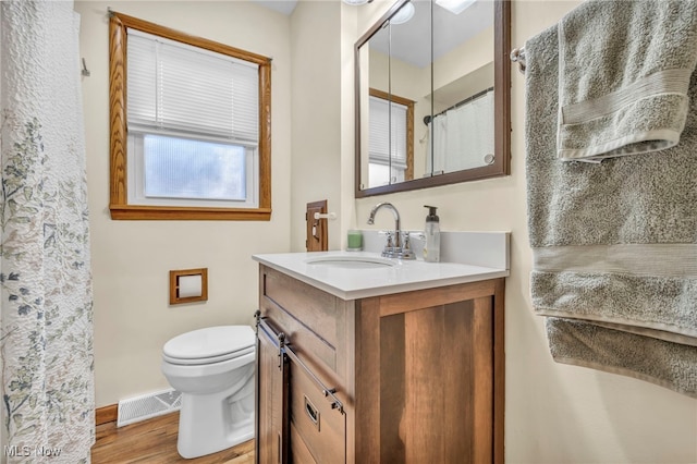 bathroom featuring toilet, a shower with curtain, vanity, and wood-type flooring