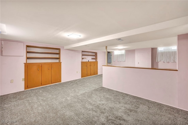 basement with electric panel and carpet floors