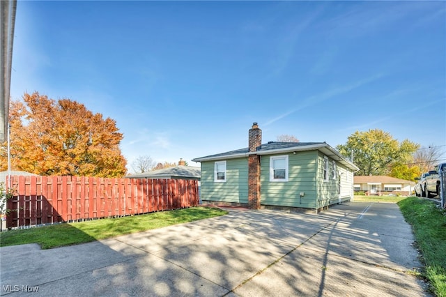 rear view of property featuring a patio area