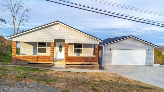 single story home featuring a garage and a porch