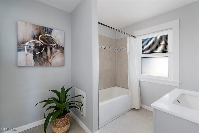 bathroom with tile patterned flooring, vanity, and shower / tub combo