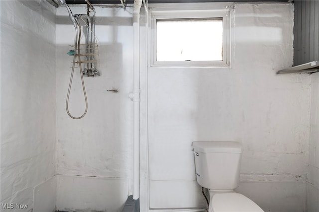 bathroom with a shower and toilet