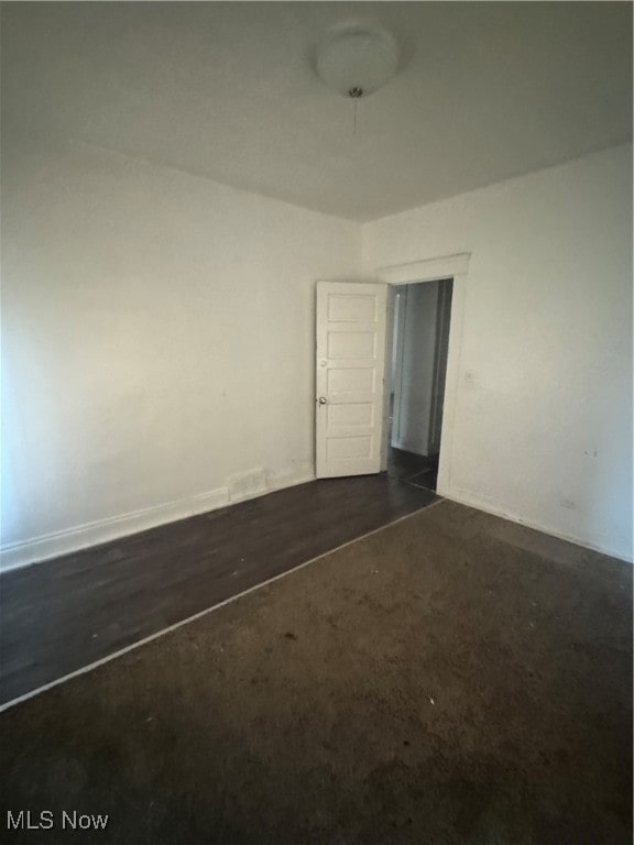 empty room featuring dark hardwood / wood-style floors