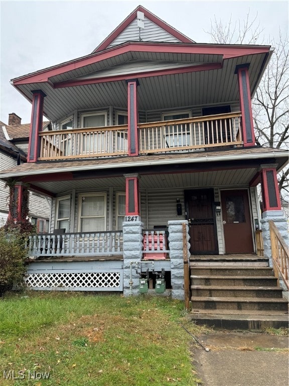 view of front facade featuring a porch and a balcony