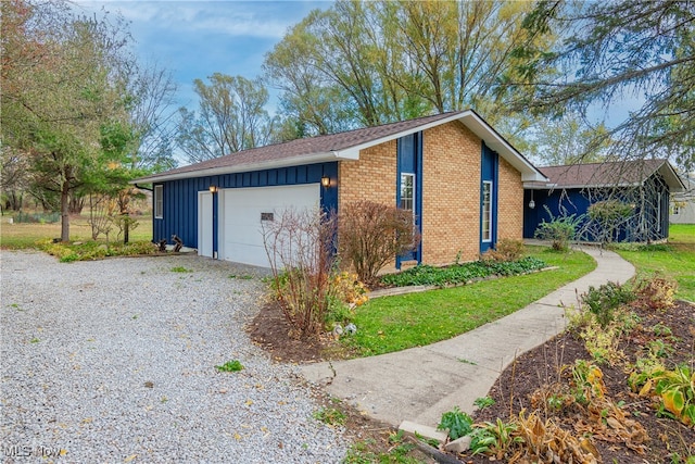 view of property exterior with a garage and a yard