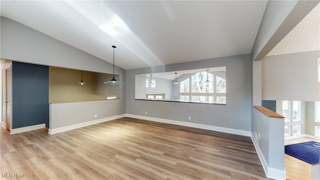 unfurnished living room with light hardwood / wood-style flooring and lofted ceiling