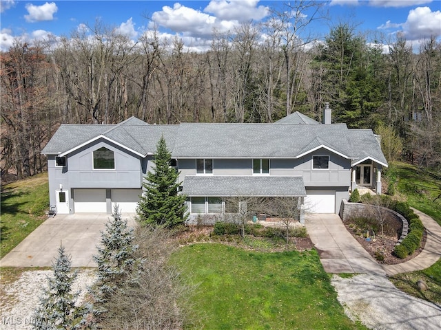 view of front of home with a garage and a front yard