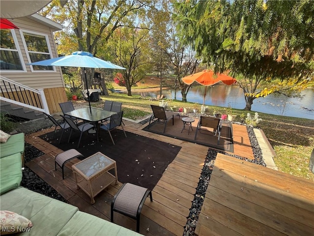 deck featuring a water view