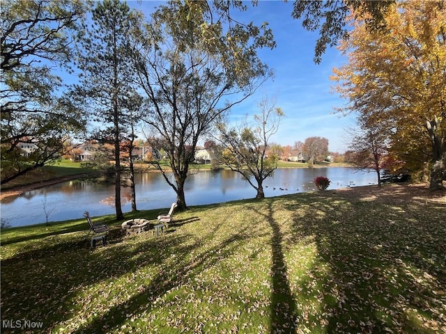 property view of water featuring a fire pit