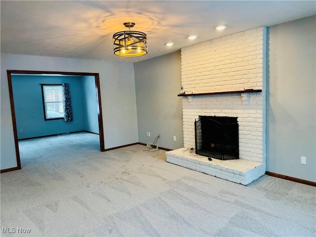 unfurnished living room with light colored carpet and a brick fireplace