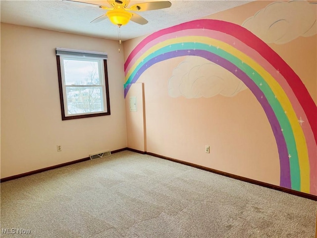 carpeted empty room with ceiling fan