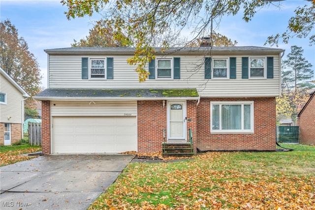 view of front facade featuring a garage and a front yard