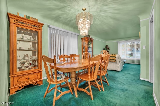 carpeted dining room with a notable chandelier